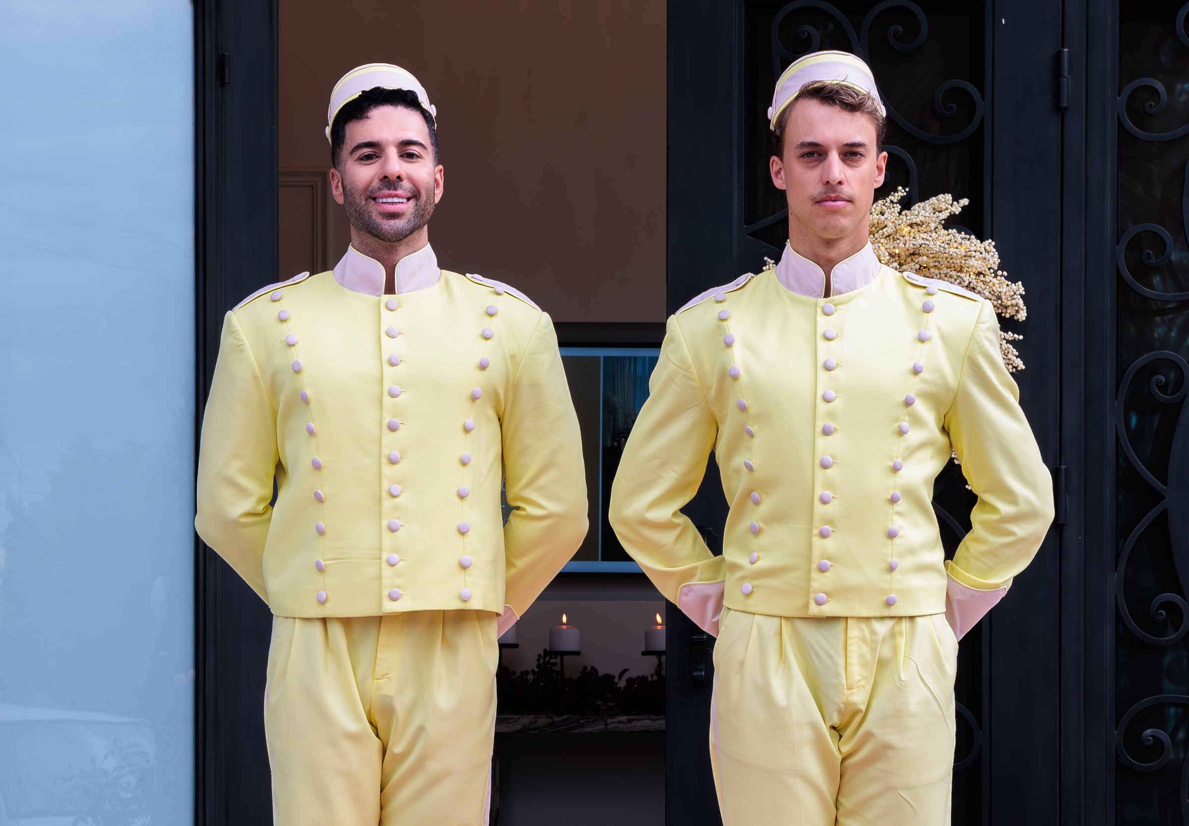 Costumed bellboy greeters welcoming guests at the Melrose entrance