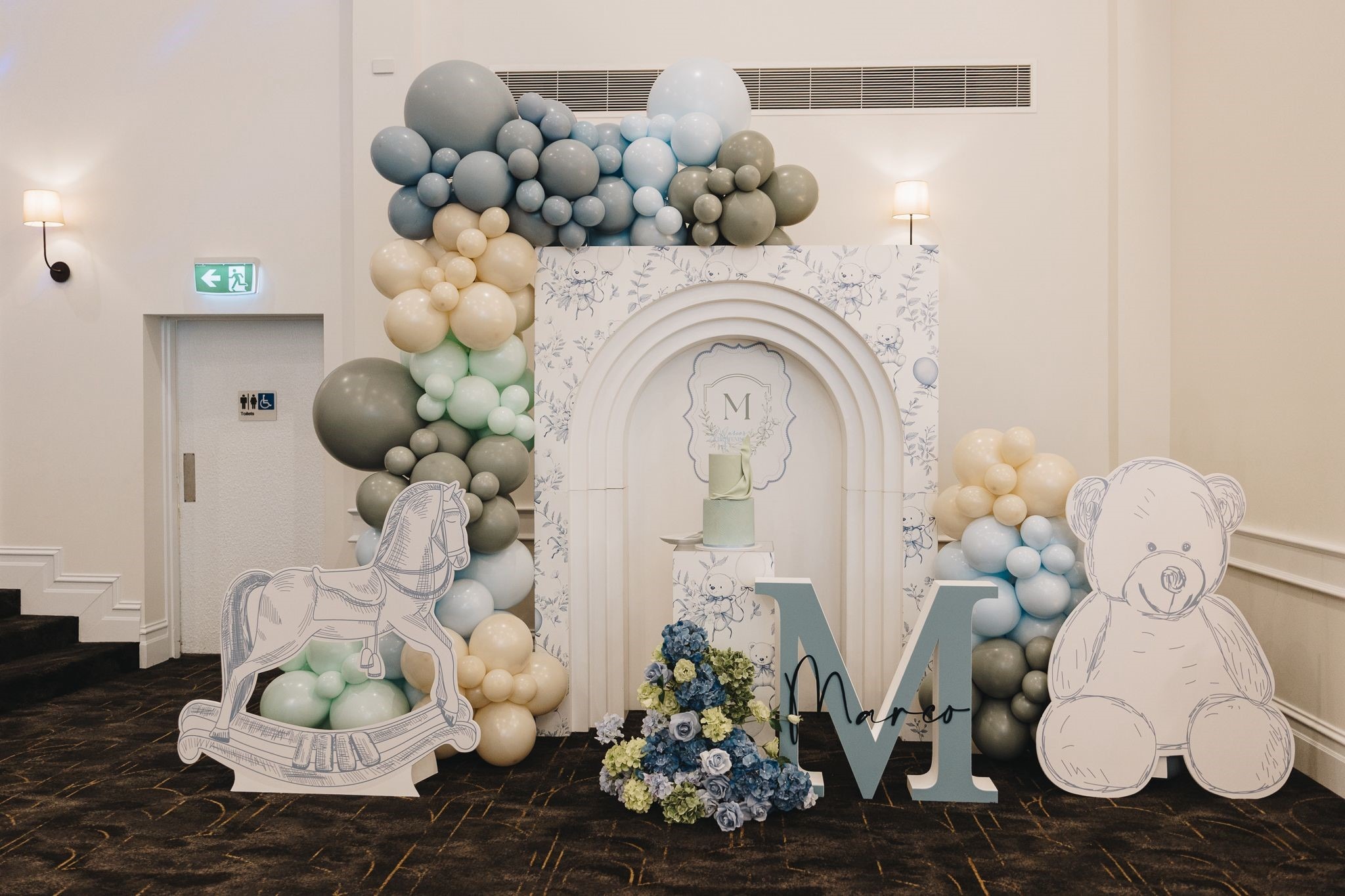 Balloon arch and backdrop styled for a christening at Melrose Events