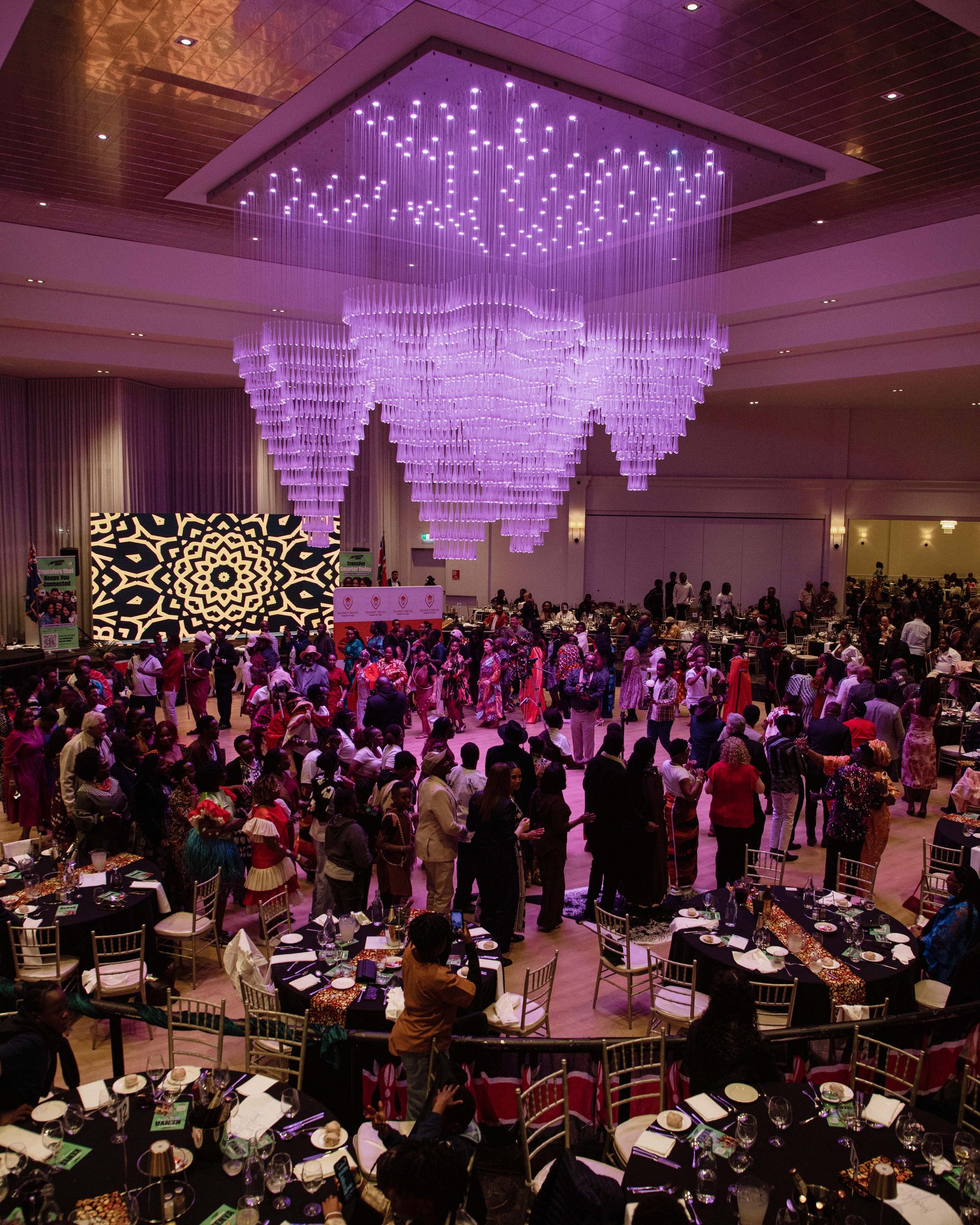 Elevated view of the Melrose ballroom set with round tables for a cultural celebration