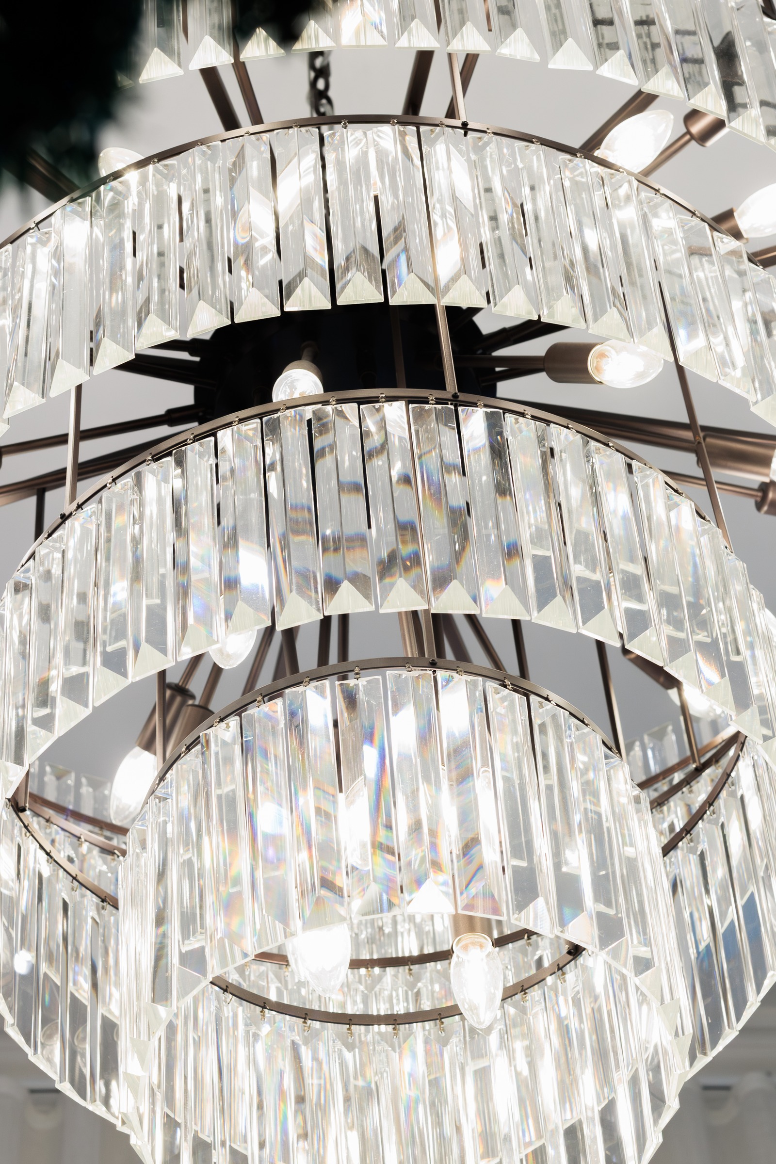 Close-up of a tiered crystal chandelier in the Melrose foyer