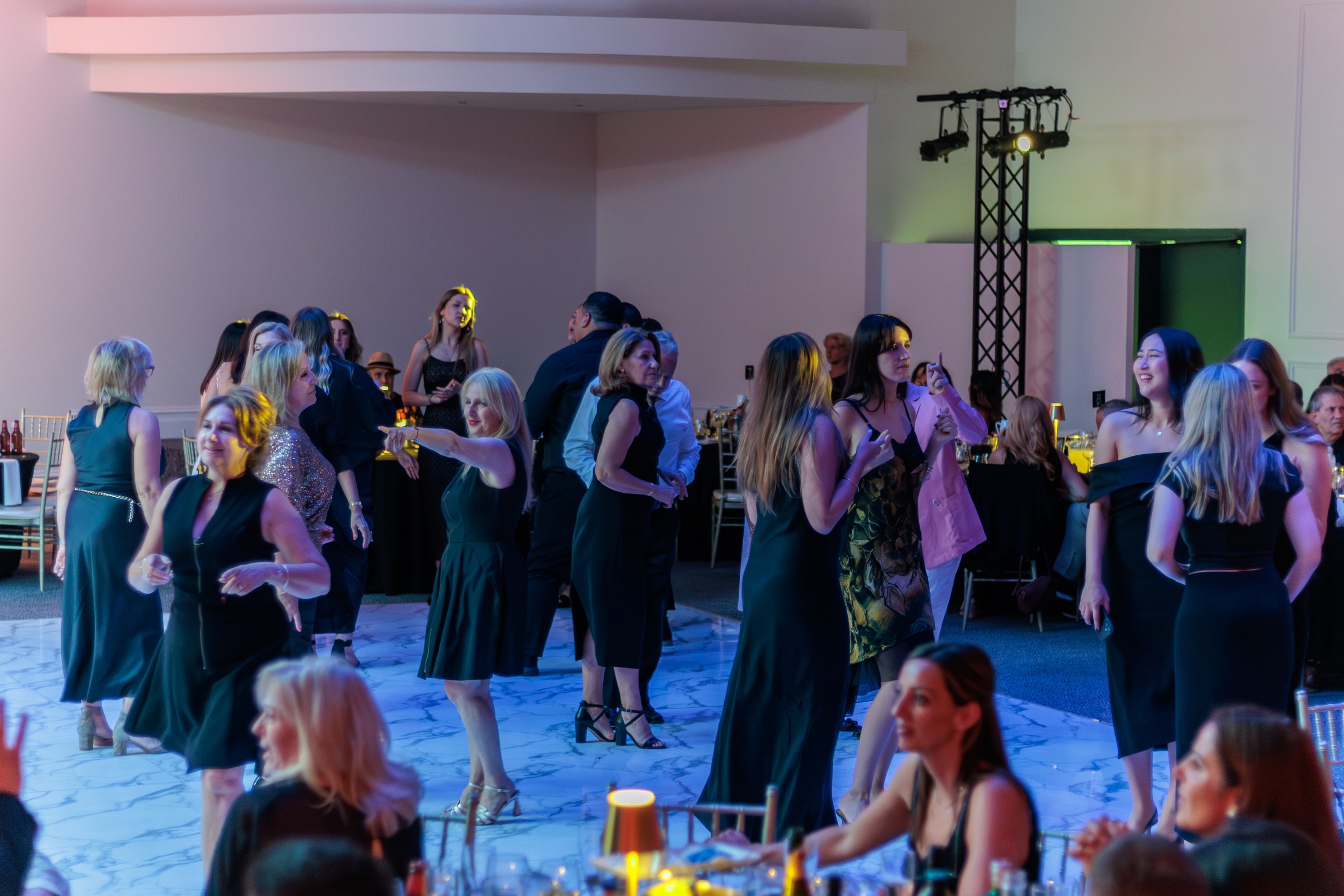 Guests dancing on the ballroom floor at a corporate event