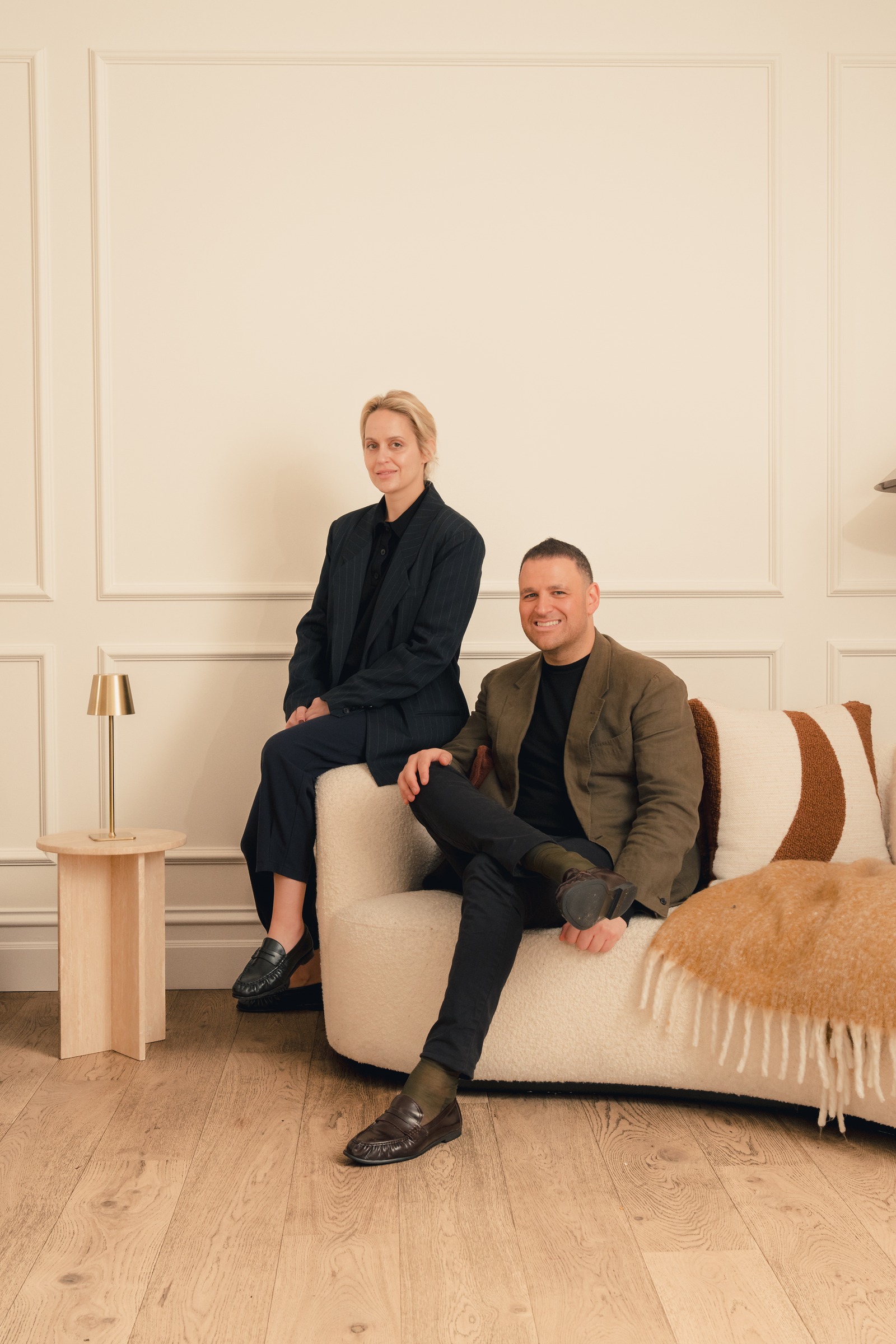Melrose Events team members seated together in a neutral lounge setting