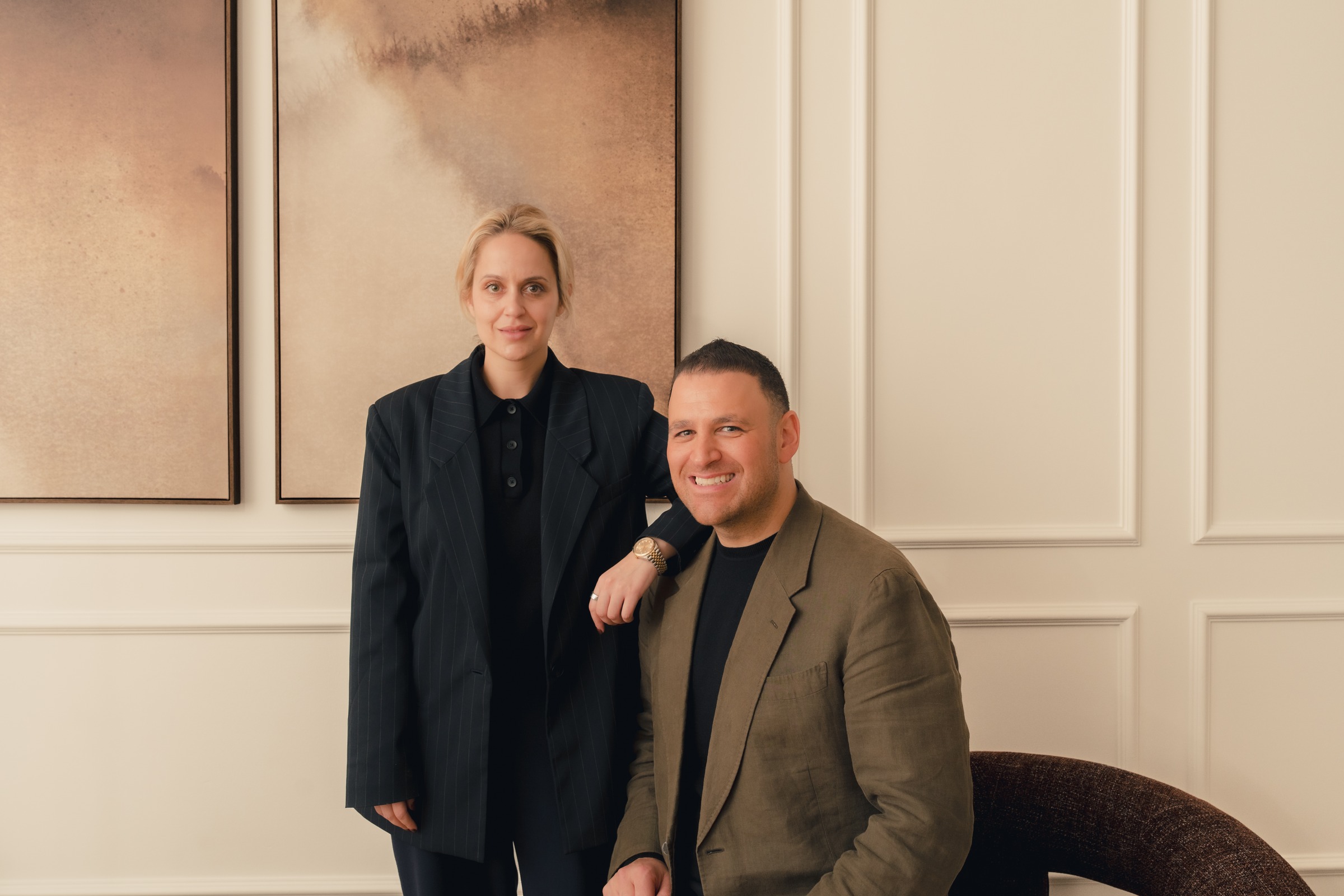 Two Melrose Events team members posing in the venue lounge