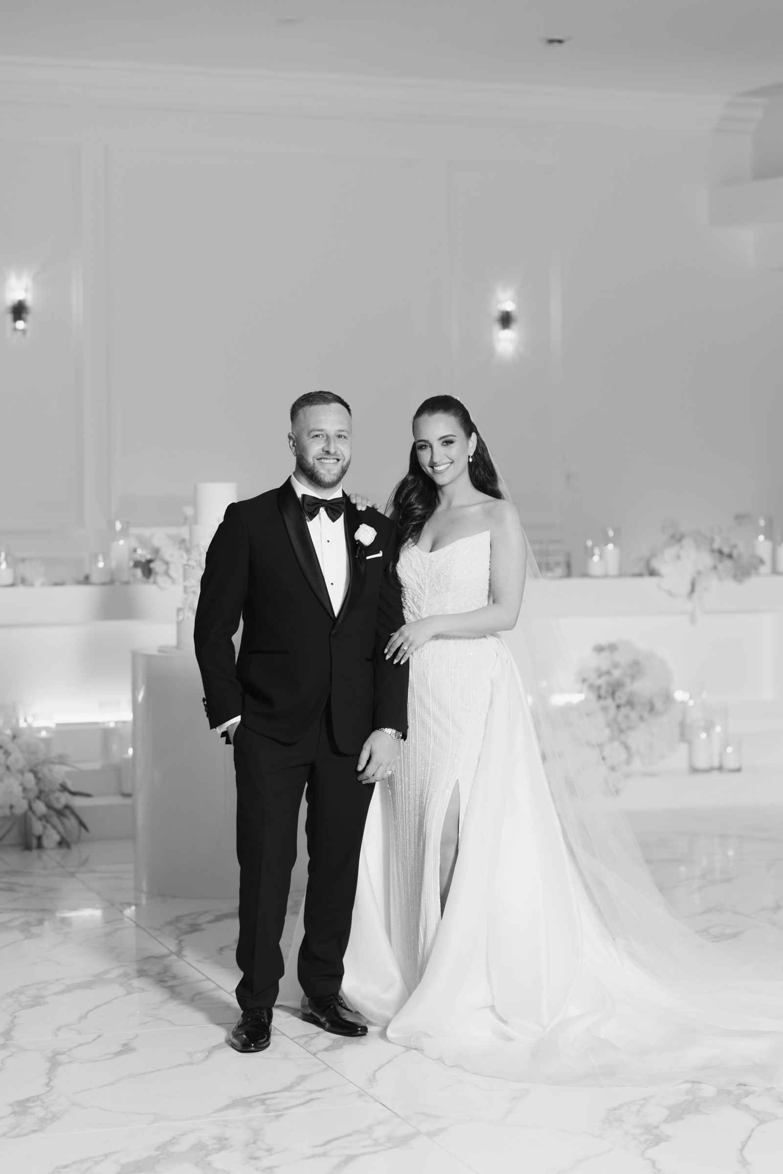 Black and white portrait of a bride and groom in the Melrose reception room